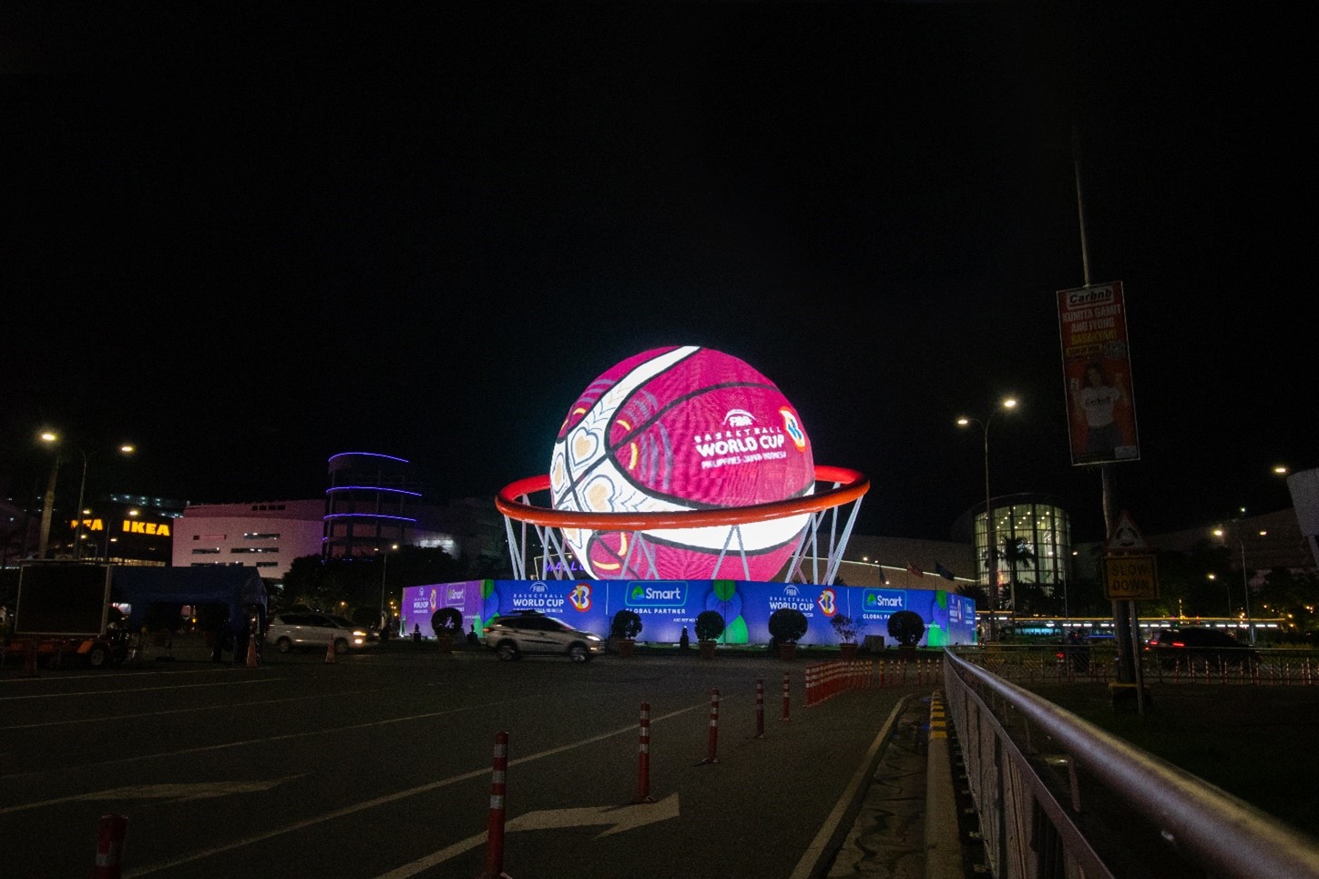an led screen in a shape of a sphere placed outside a mall