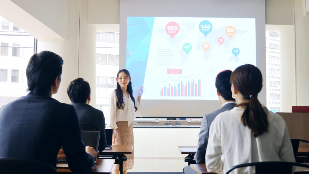 group of professionals looking at a projector
