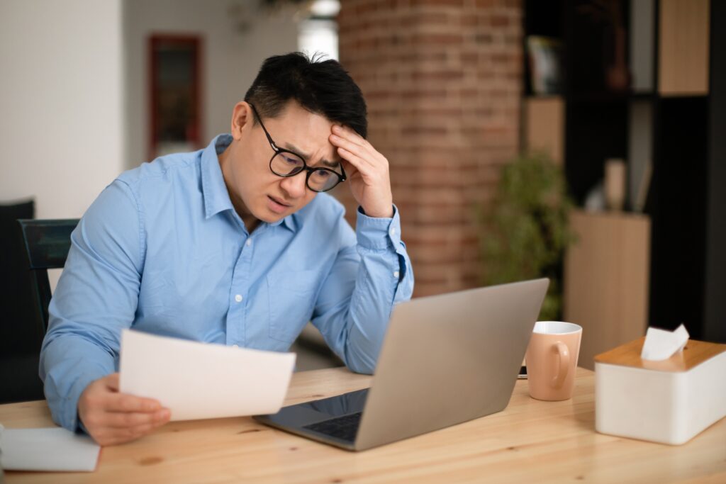 a distressed retail owner reading a document