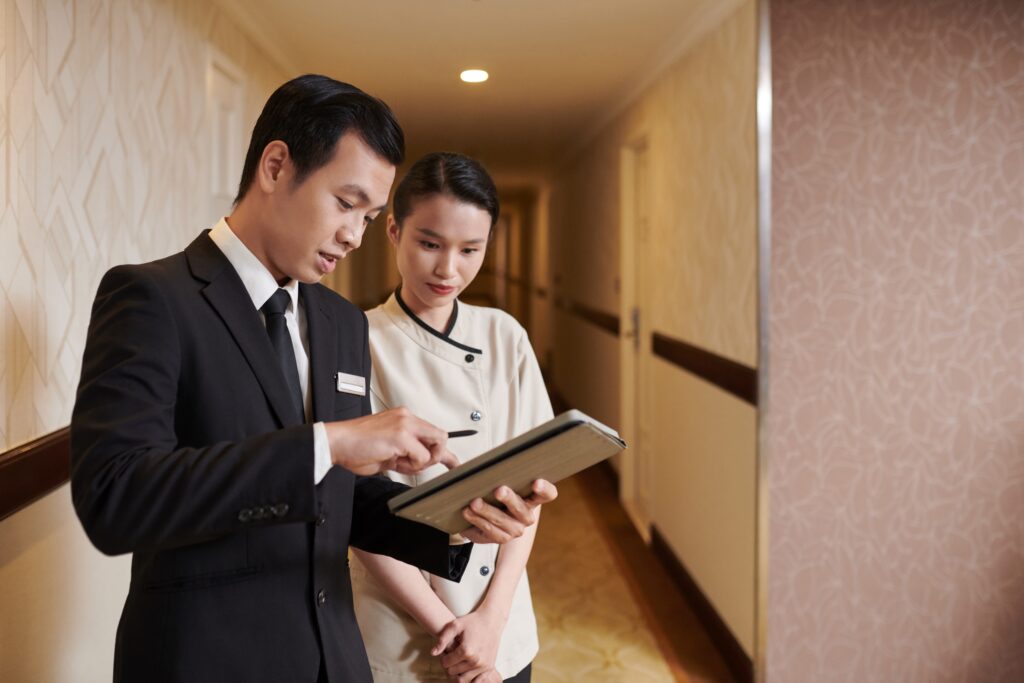 a hotel manager talking to a housekeeper