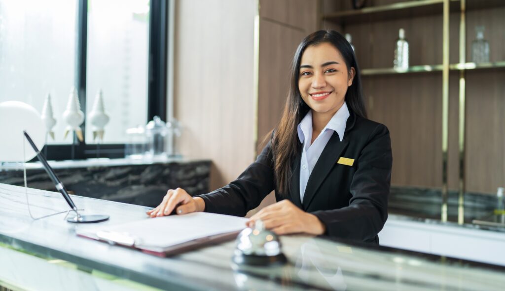 a hotel manager smiling